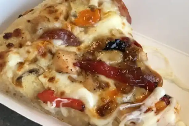 a close up of a slice of pizza