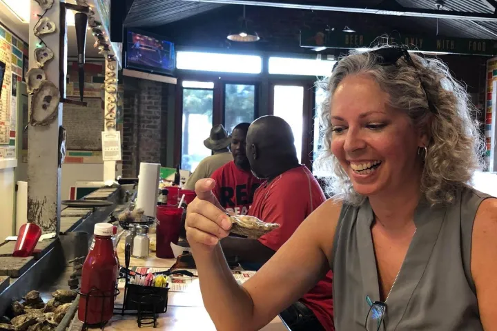 a woman sitting at a train station