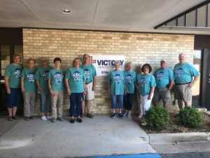 a group of people standing in front of a building