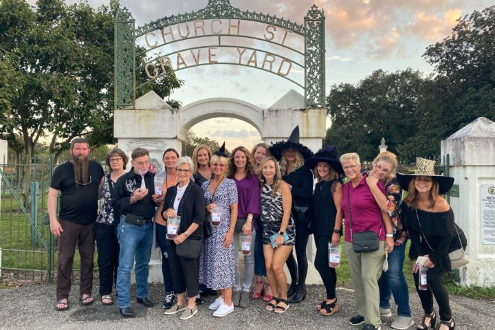 a group of people standing in front of a building