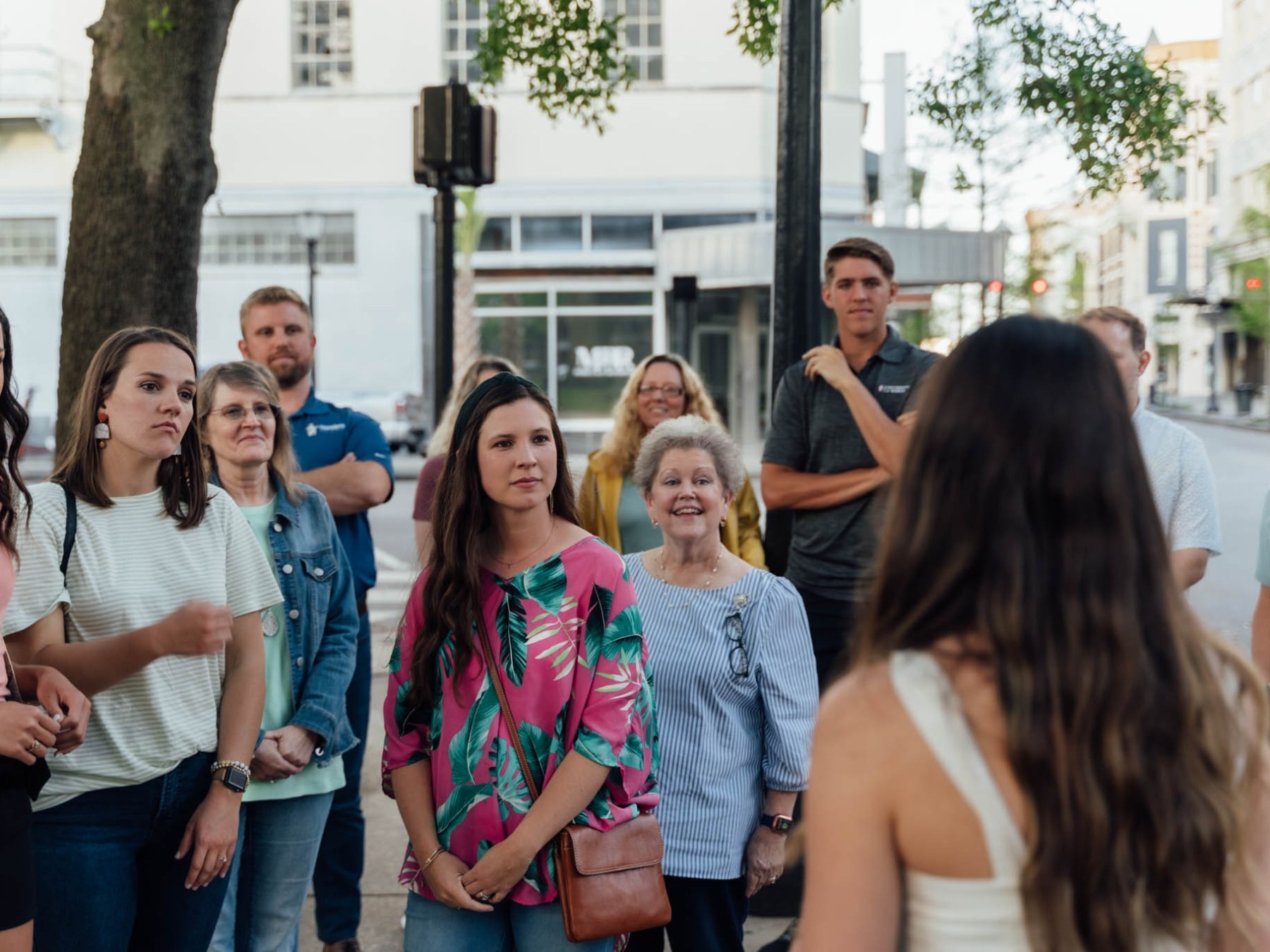 Jeff Kinney et al. standing in front of a crowd posing for the camera