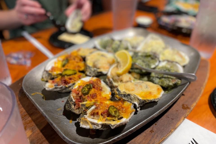 a pizza sitting on top of a wooden table