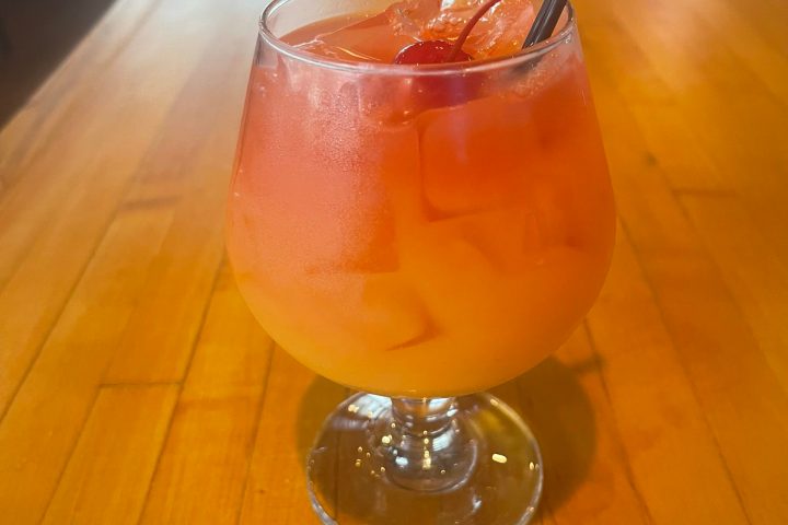 a glass of beer on a table