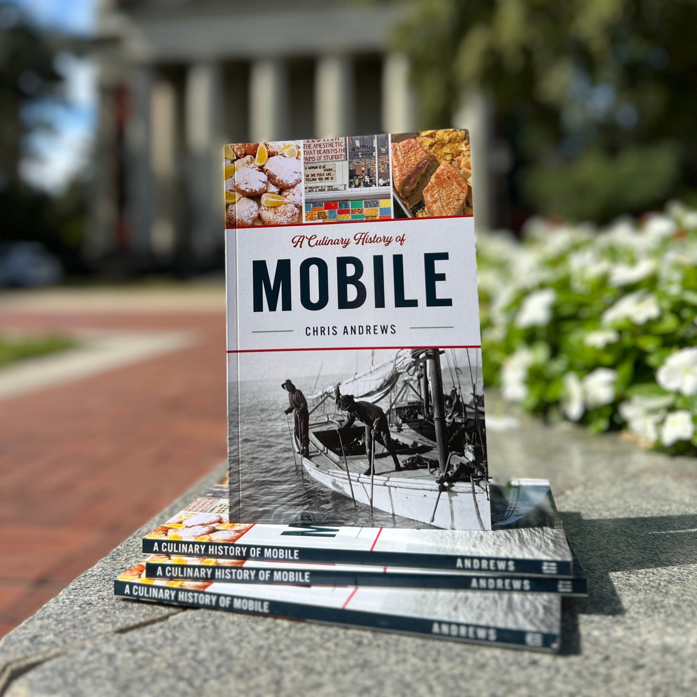 a stack of flyers on a sidewalk