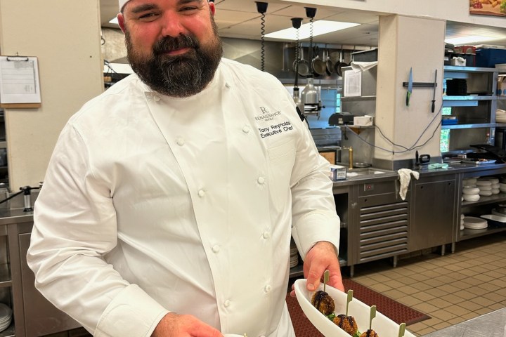 a man preparing food in a kitchen