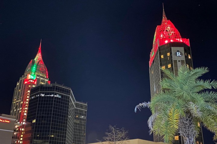 a clock tower lit up at night